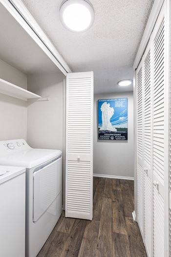 A laundry room with a washer and dryer.